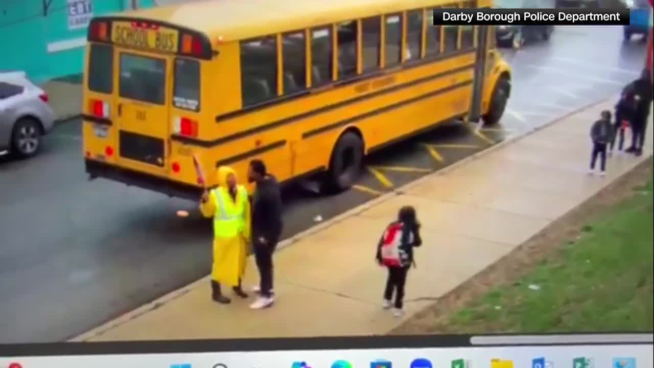 Man arrested after crossing guard assaulted in front of school bus on video