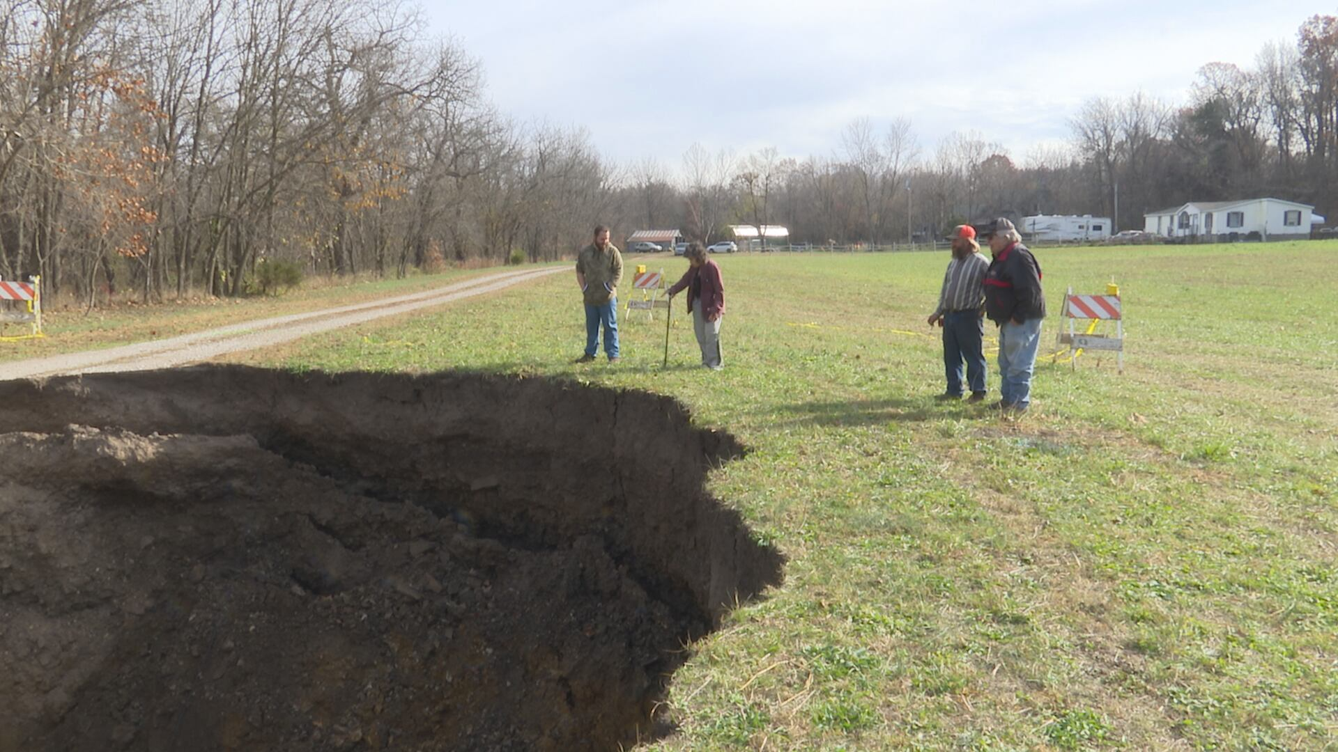 It was wild, just roaring': Massive sinkhole takes over man's driveway